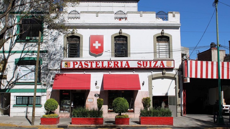 The red and white facade of the Pasteleria Suiza building.