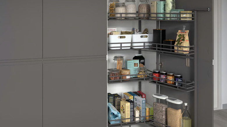 UTRUSTA pantry unit with various condiments and foods attached to an open cabinet