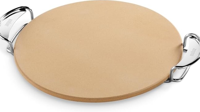 Weber pizza stone on white background