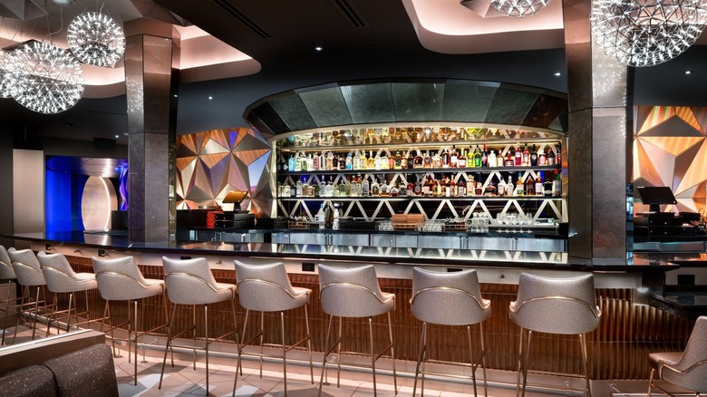 Row of barstools at a modern-looking bar