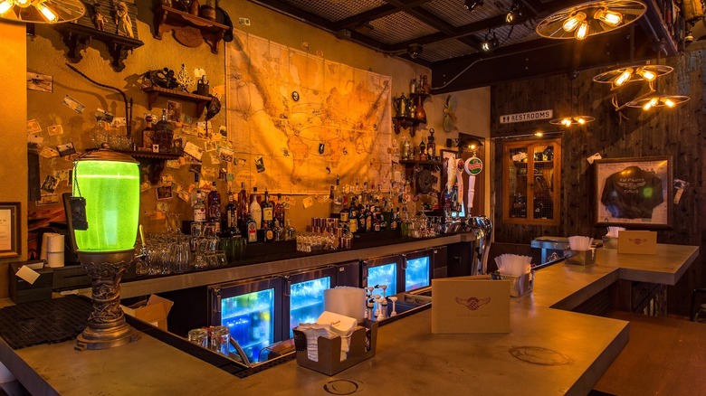 Vintage bar with world map hanging on back wall