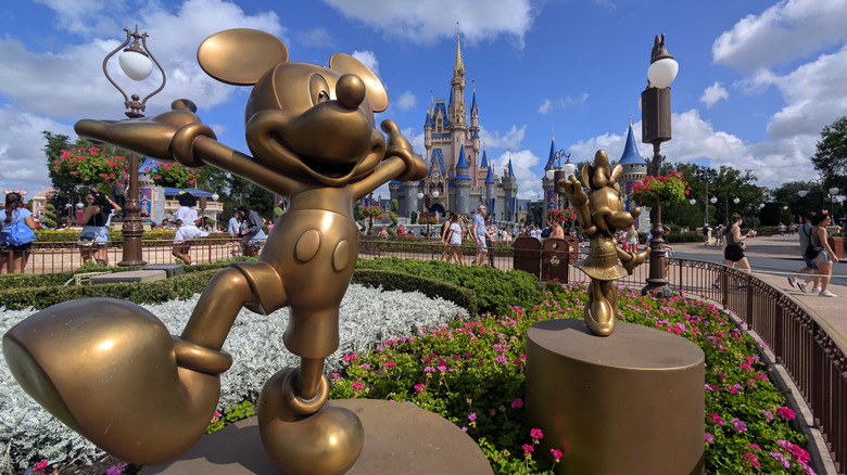 Golden Mickey Mouse and Minnie Mouse statues at Walt Disney World