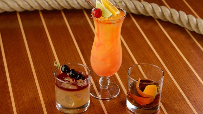 Three cocktails on a wooden table