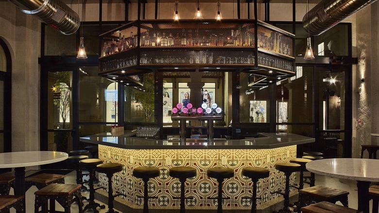 Octagonal whiskey bar at The Polite Pig in Disney Springs