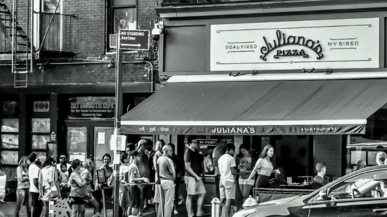 Exterior of Juliana's Pizza in black and white