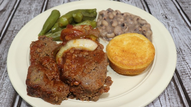 Plate of meatloaf, okra, black eyed peas and cornbread