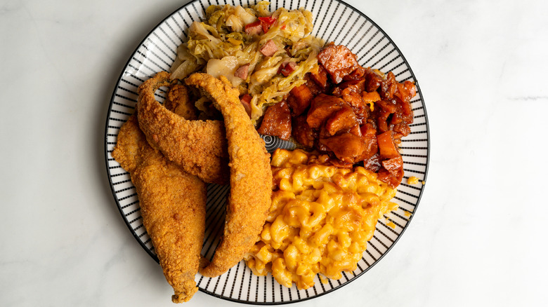 Plate of fried fish and soul food side dishes
