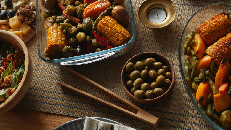 Plates of vegan soul food arranged on a large table