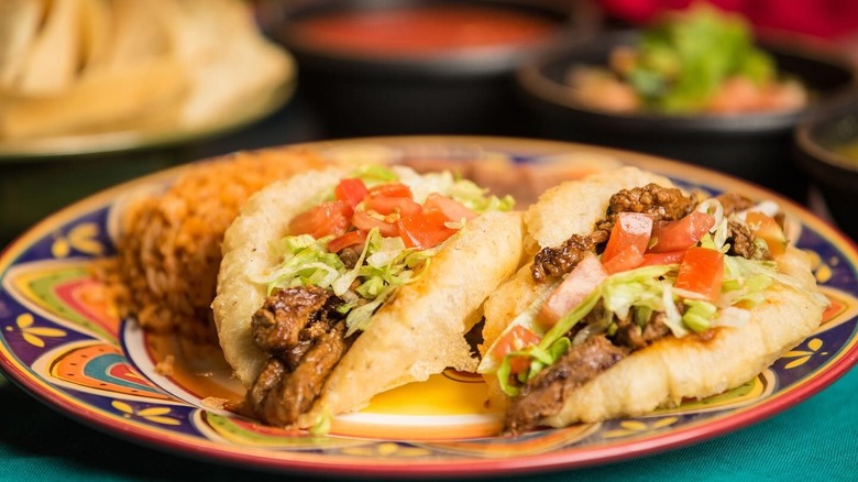 Beef puffy tacos on a colorful plate