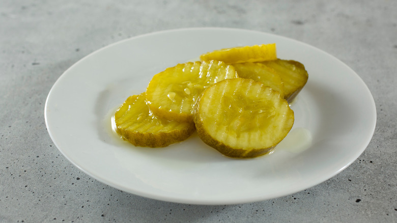 Small plate of sliced pickles