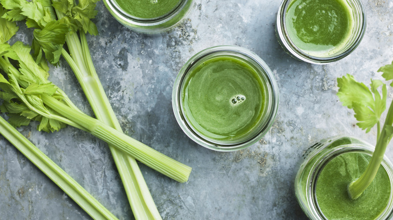 glasses on table filled with celery juice
