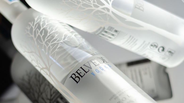 A shot of Belvedere vodka bottles seemingly swirling in the air