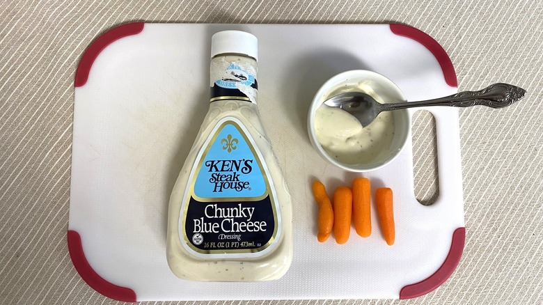 Ken's Steak House Chunky Blue Cheese Dressing on a table with sample and carrots