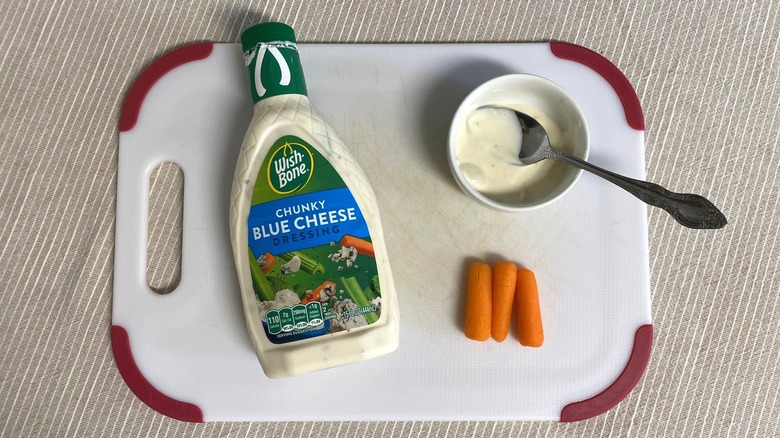 Wish-Bone Blue Cheese Dressing on a table with sample and baby carrots