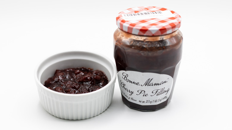 Bonne Maman cherry pie filling on white surface with jar