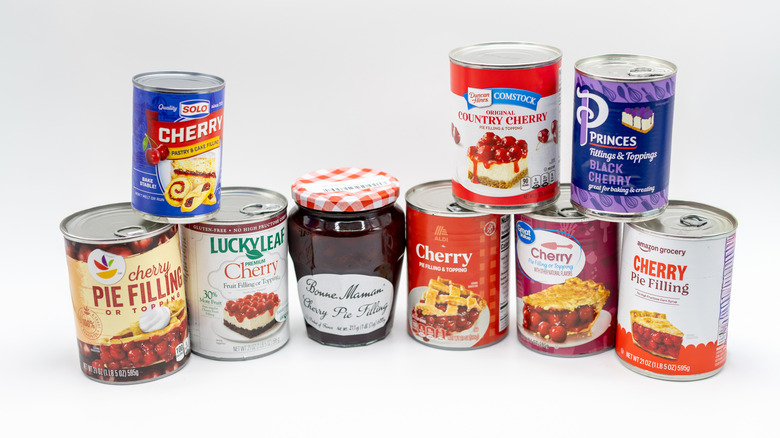 Cherry Pie filling cans on white background