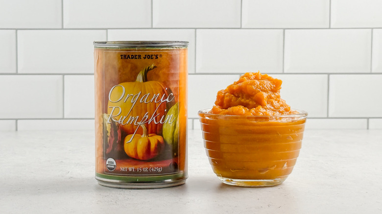 A can and a small glass bowl of Trader Joe's pumpkin purée