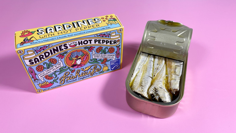 A tin of Fishwife sardines with chili opened, next to the box