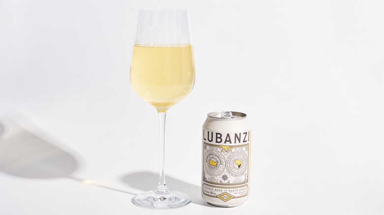 Can of Lubanzi Chenin Blanc next to a filled wine glass
