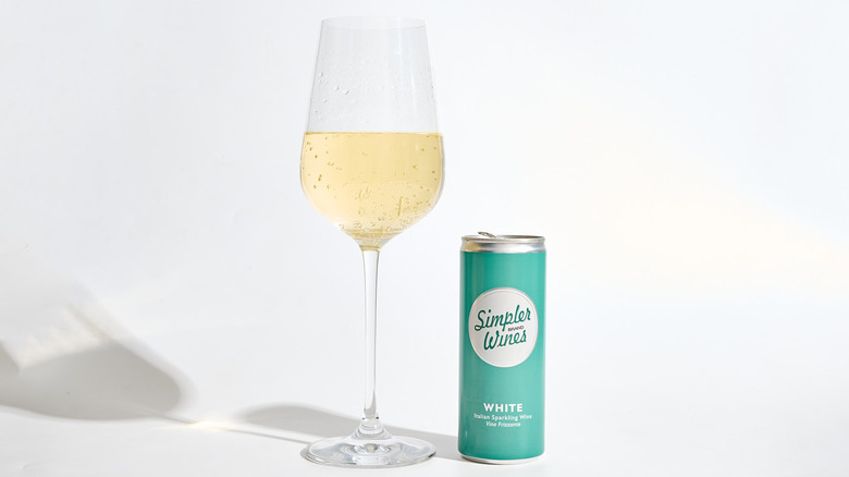 Can of Simpler Wines White next to a filled wine glass