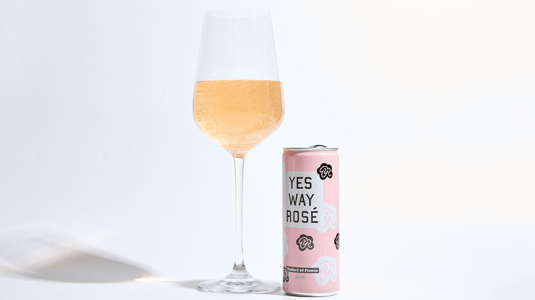 Can of Yes Way Rosé next to a filled wine glass