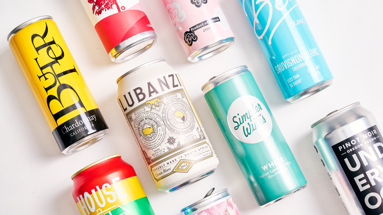 canned wines spread out on a white table