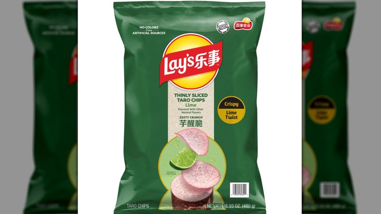 A geen bag of Lay's Thinly Sliced Lime Taro Chips against a white background