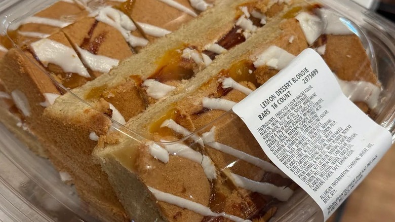 Close-up of plastic container of lemon dessert blondie bars