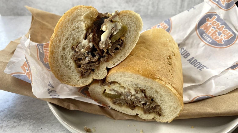 Jersey Mike's Famous Philly sandwich cut in half on the take-out wrapping paper.