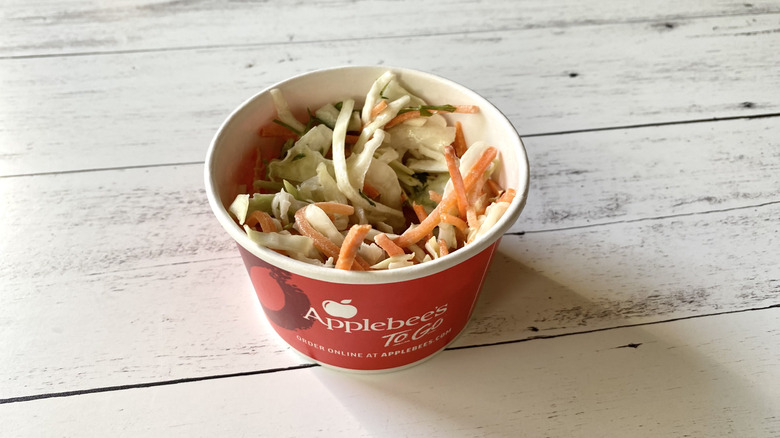 Applebee's coleslaw in a red take-out container
