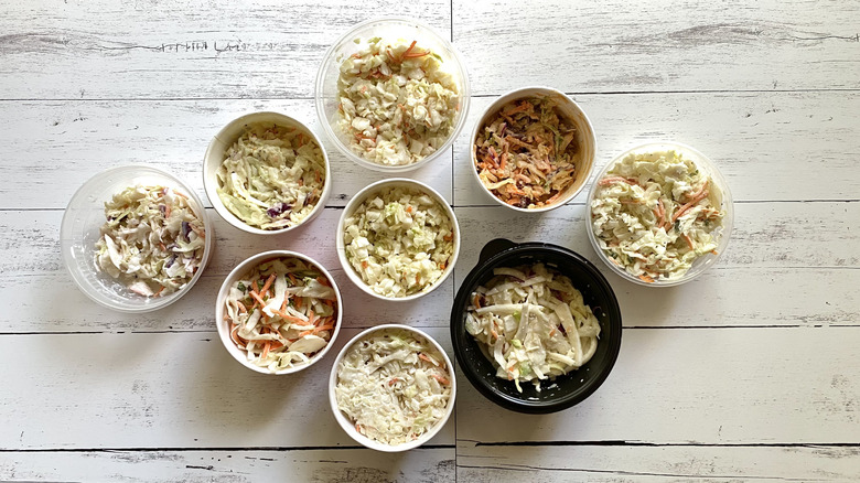 Assorted fresh coleslaws in various containers