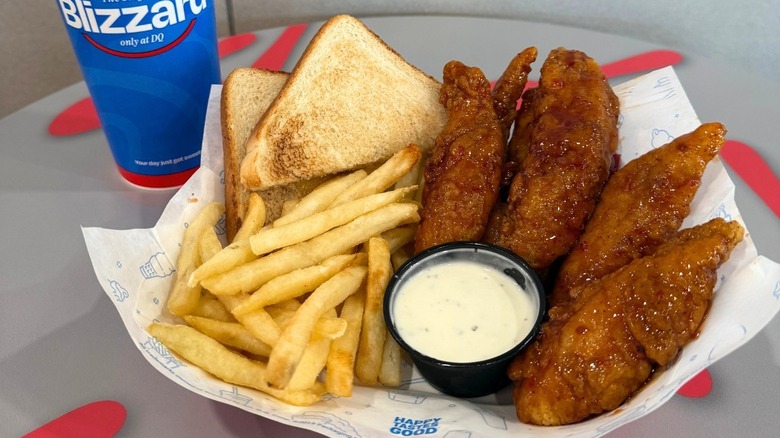 A basket of Chicken Strips, fries, toast, and sauce from Dairy Queen