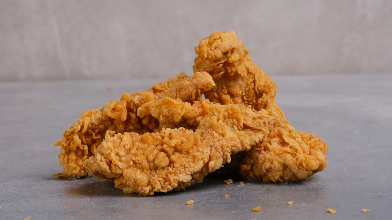 A pile of chicken tenders on a table