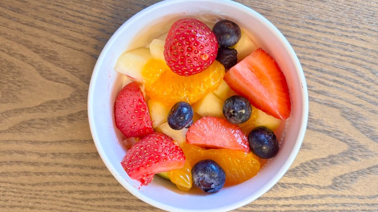 A Chick-fil-A Fruit Cup with strawberries, blueberries, mandarin orange slices, and apples