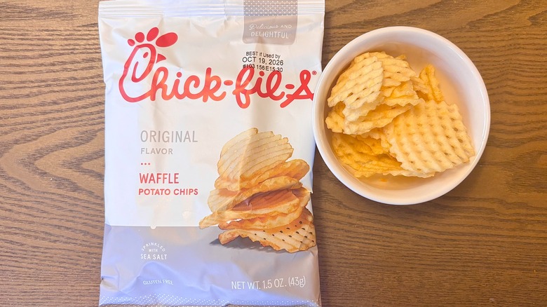 A bag of Chick-fil-A Original Flavor Waffle Potato Chips next to a small bowl of the chips