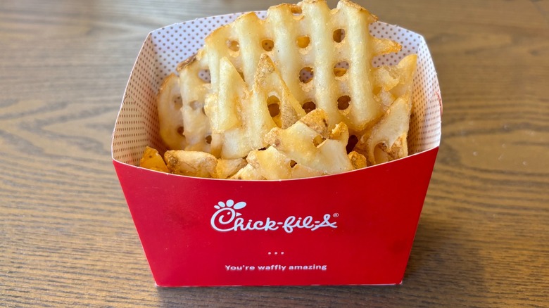 A red container of Chick-fil-A waffle fries
