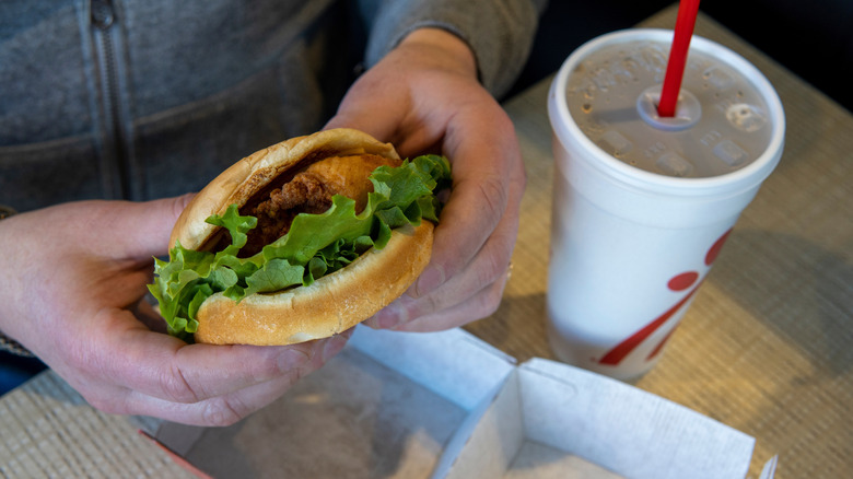 Person holding Chick-fil-A chicken sandwich
