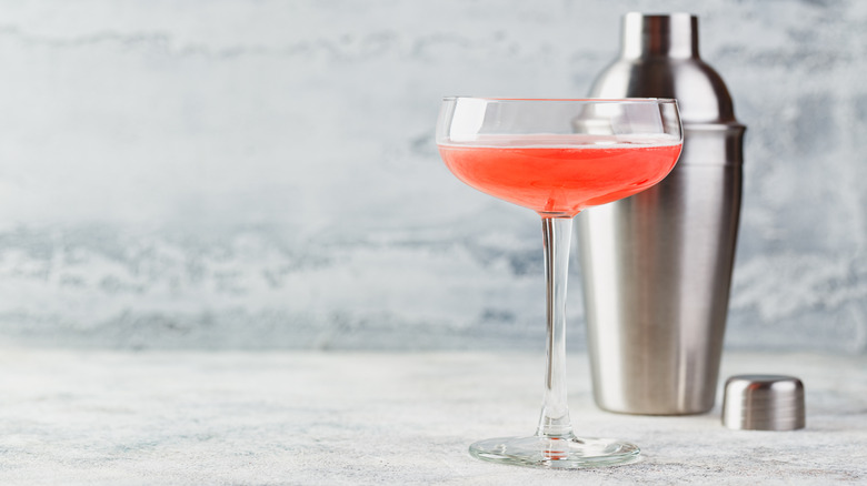 Royal Cosmopolitan and cocktail shaker on a marbled background