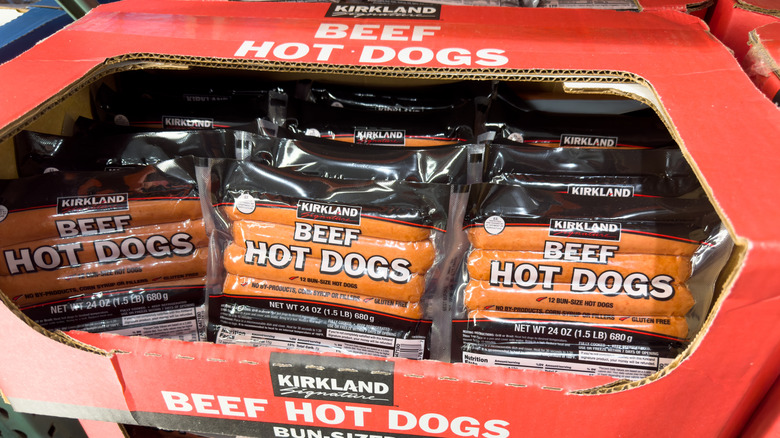 Cardboard box of Kirkland Signature Beef Hot Dog packages in Costco
