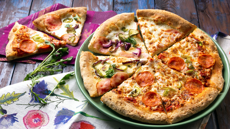 Pizza with pickles on a plate