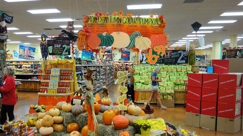 The interior of a Trader Joe's with a pumpkin display