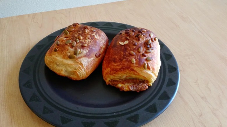 Two Pumpkin Croissants on a black plate