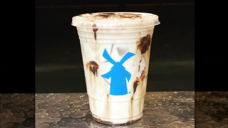 A Cookies and Creme Breva drink on a counter top