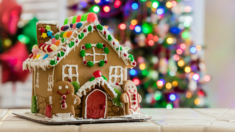 Gingerbread house with decorations and tree