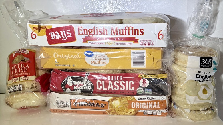 A group of English muffins in their packaging a pile