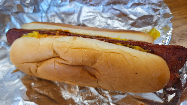 Five Guys hot dog and fries placed on foil