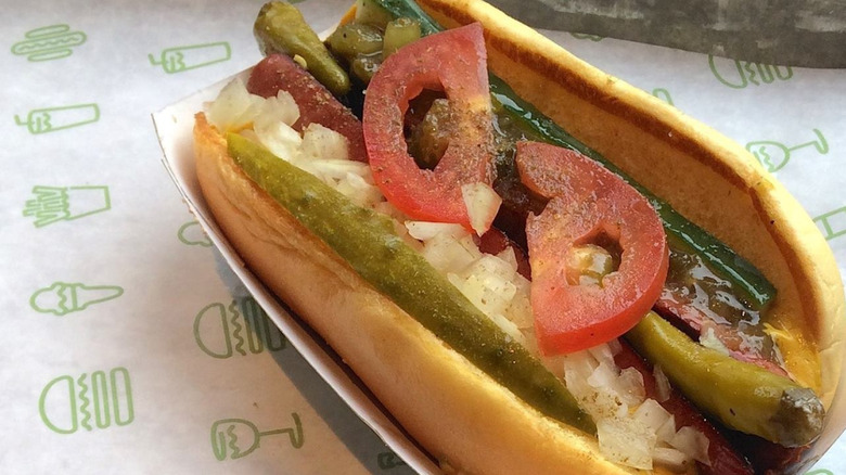 Shake Shack hot dogs dressed in onions, tomatoes, and pickles