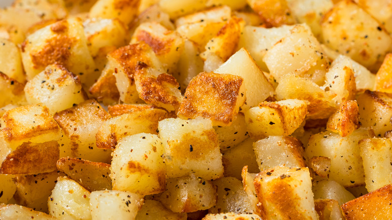Cubes of golden hash-browned potatoes
