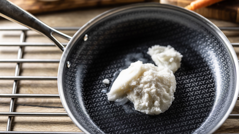 Solid lard in a nonstick pan