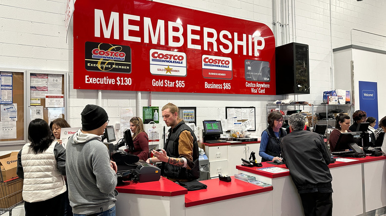 People at the Costco membership counter